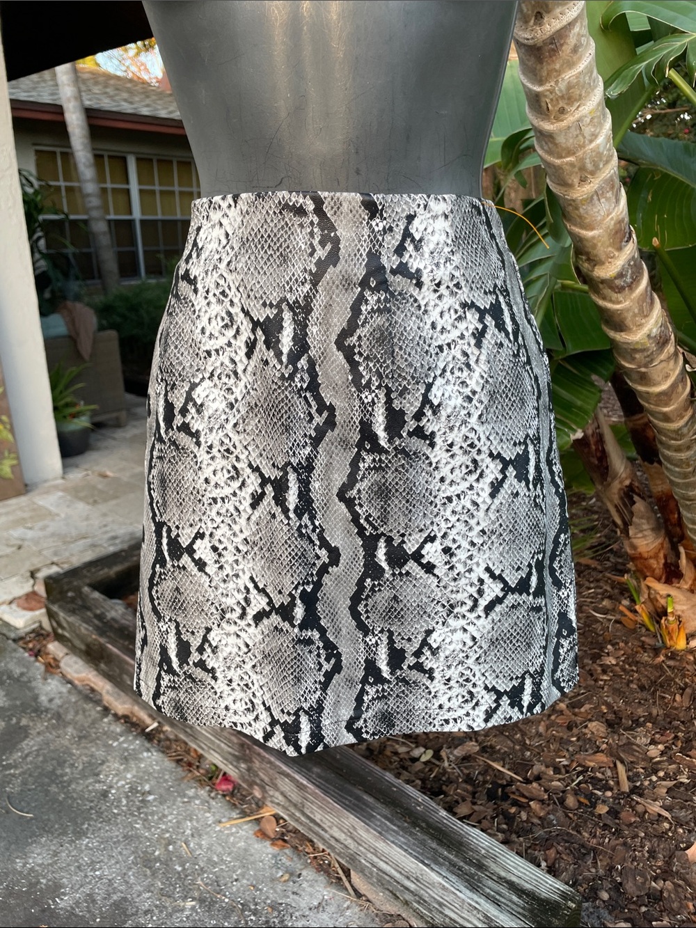 snake print vegan leather mini skirt